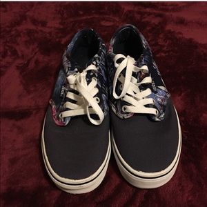 Purple vans shoes with floral print.